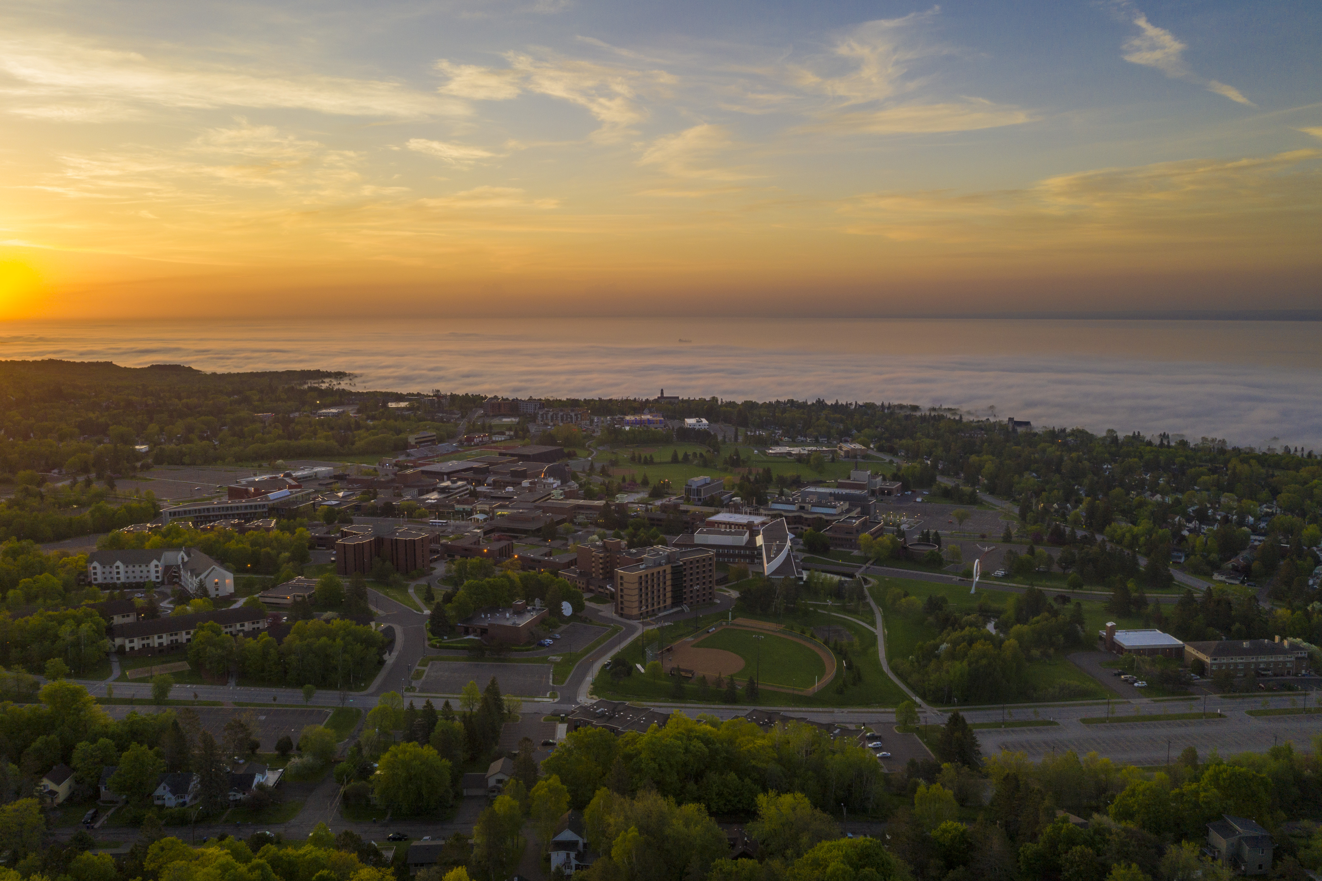 Panorama of sunrise over Lake Superior and UMD campus